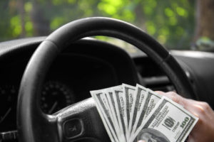 money steering wheel | Dealers Look to Incentives for New Car Profitability